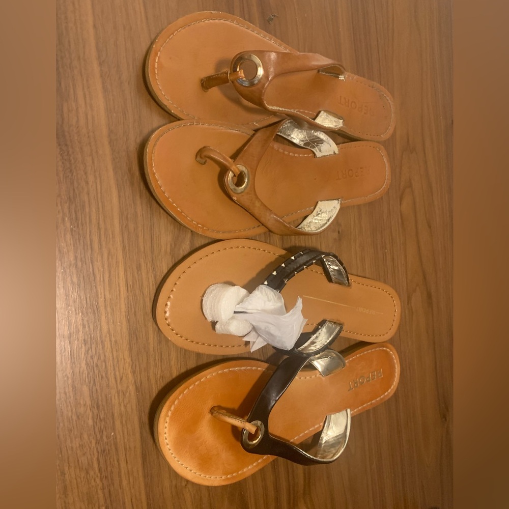 Brand is Report 2 pairs of sandals. 1 black is brand new the other brown is used
